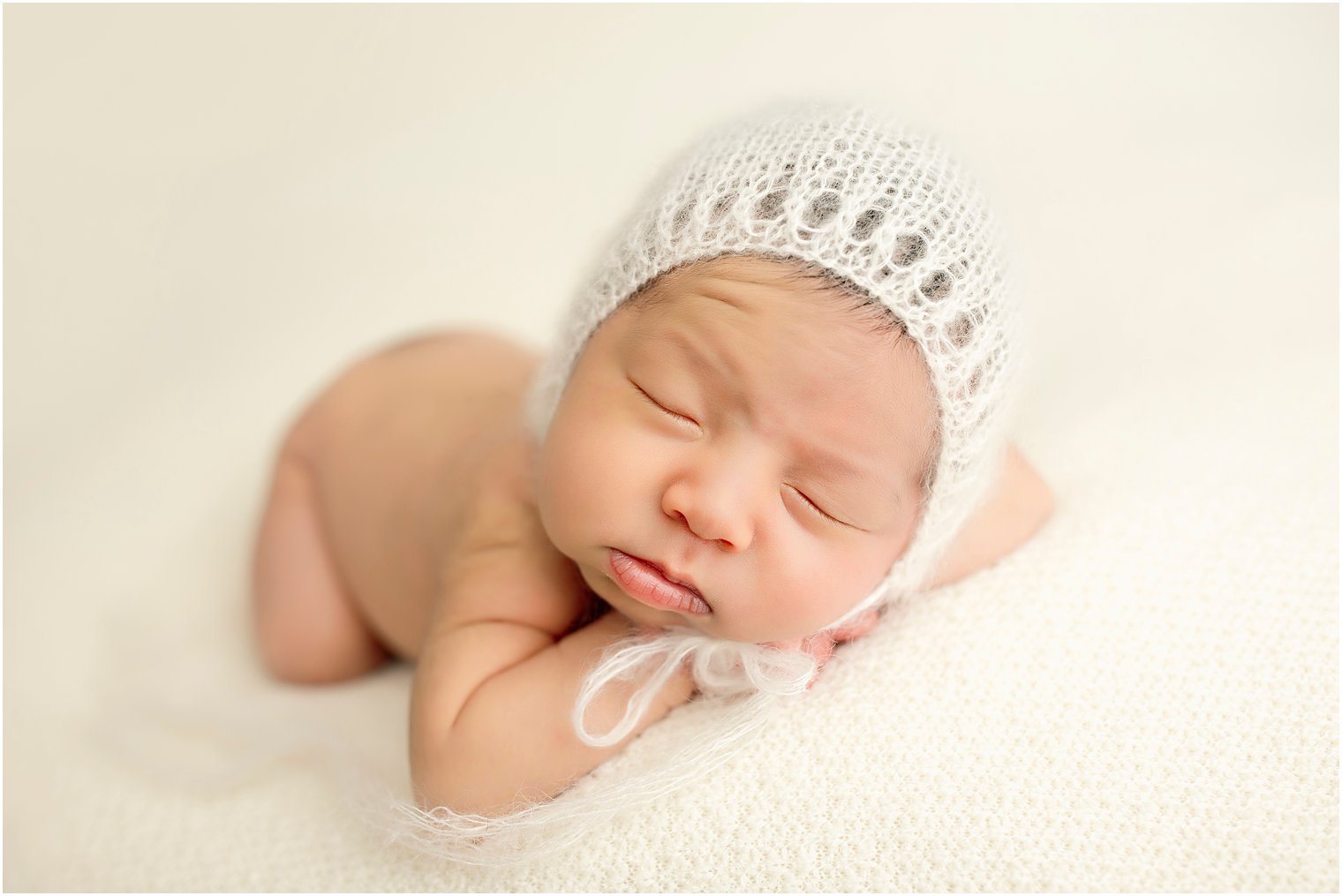 Sleepy newborn boy | Photo by Idalia Photography