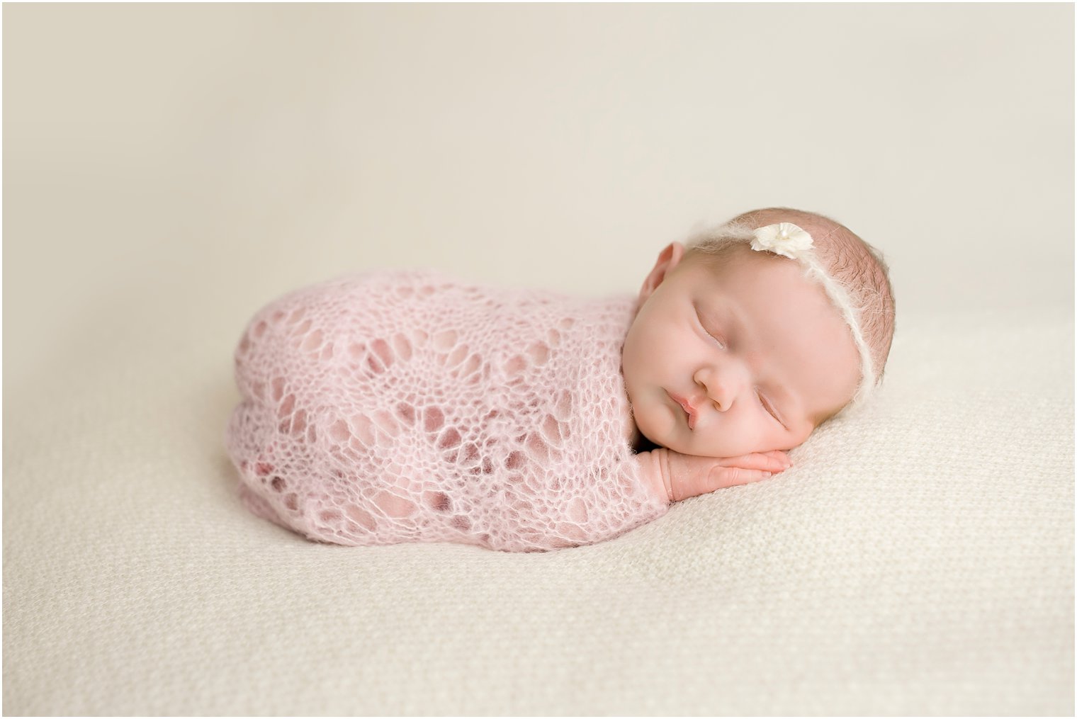 Baby girl with pink crochet wrap