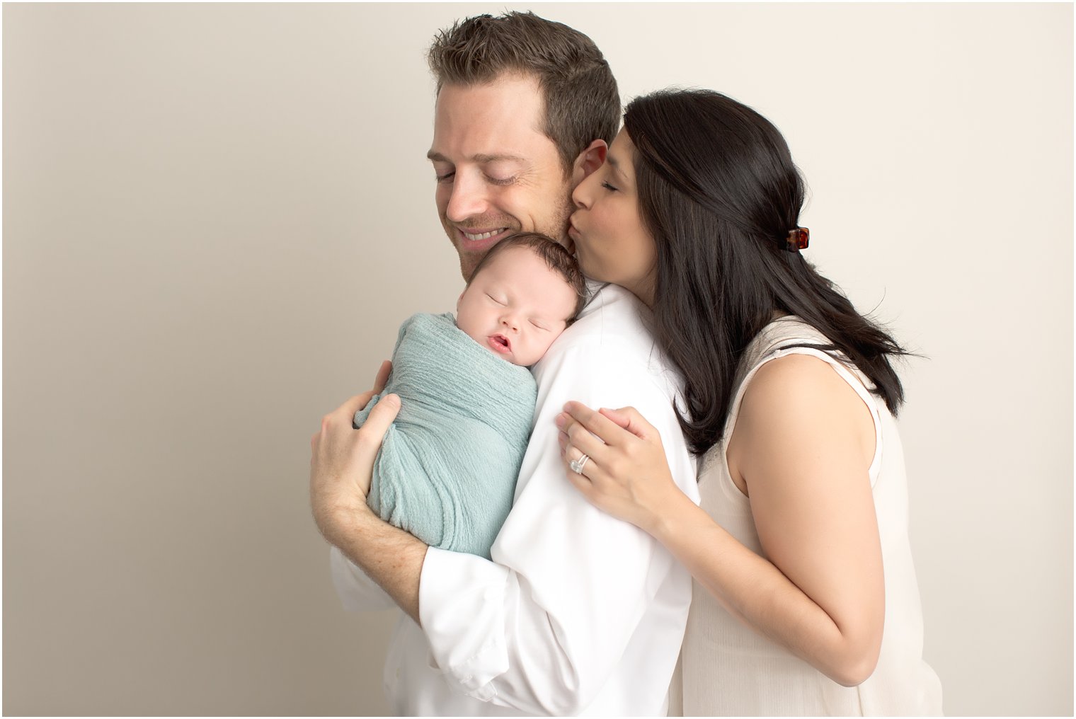 New parents and baby in Howell NJ studio newborn session