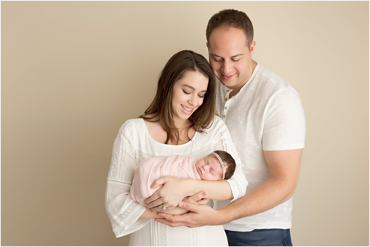 new parents and their newborn girl