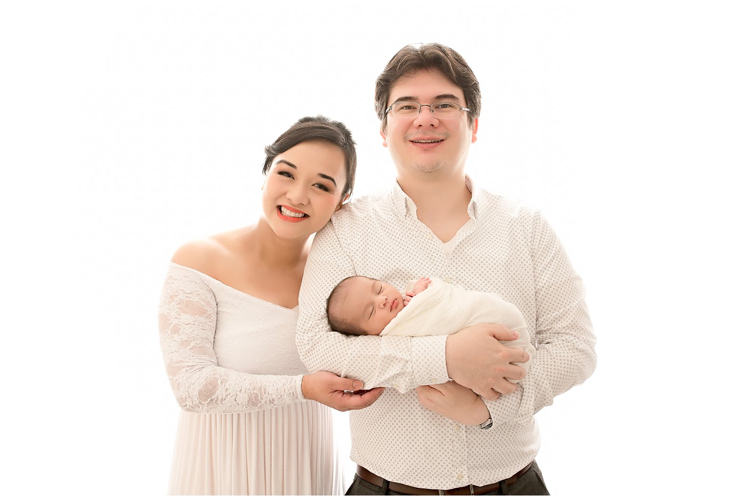 First portrait of new parents with baby