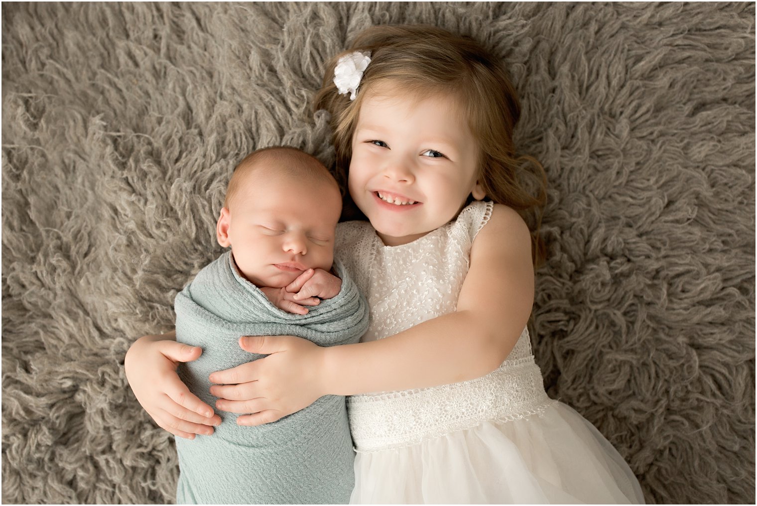 Newborn boy and his big sister