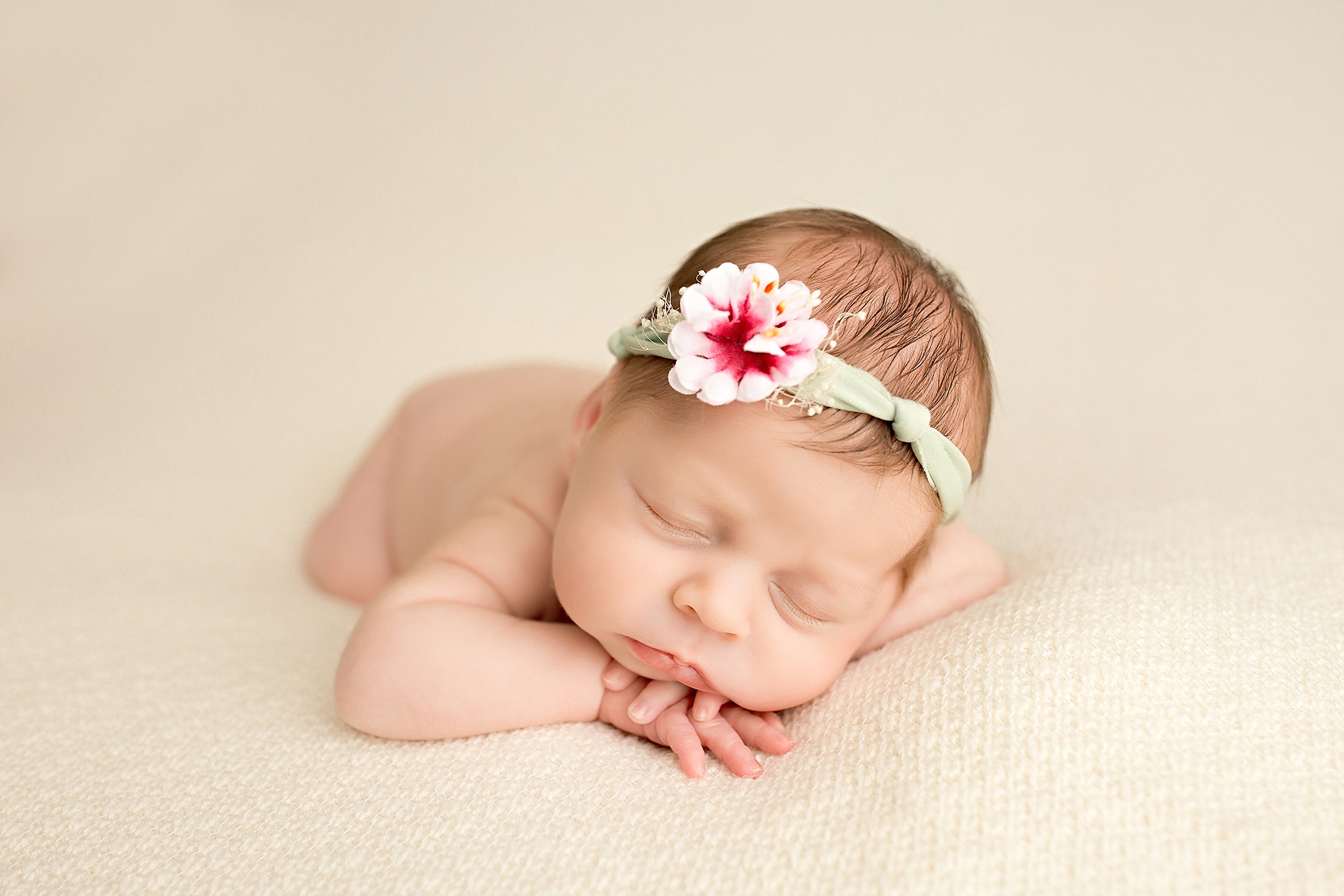 newborn girl sleeping during baby portraits