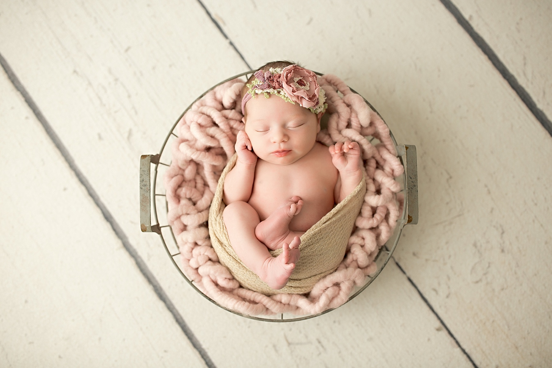 peaceful baby girl sleeping during newborn session