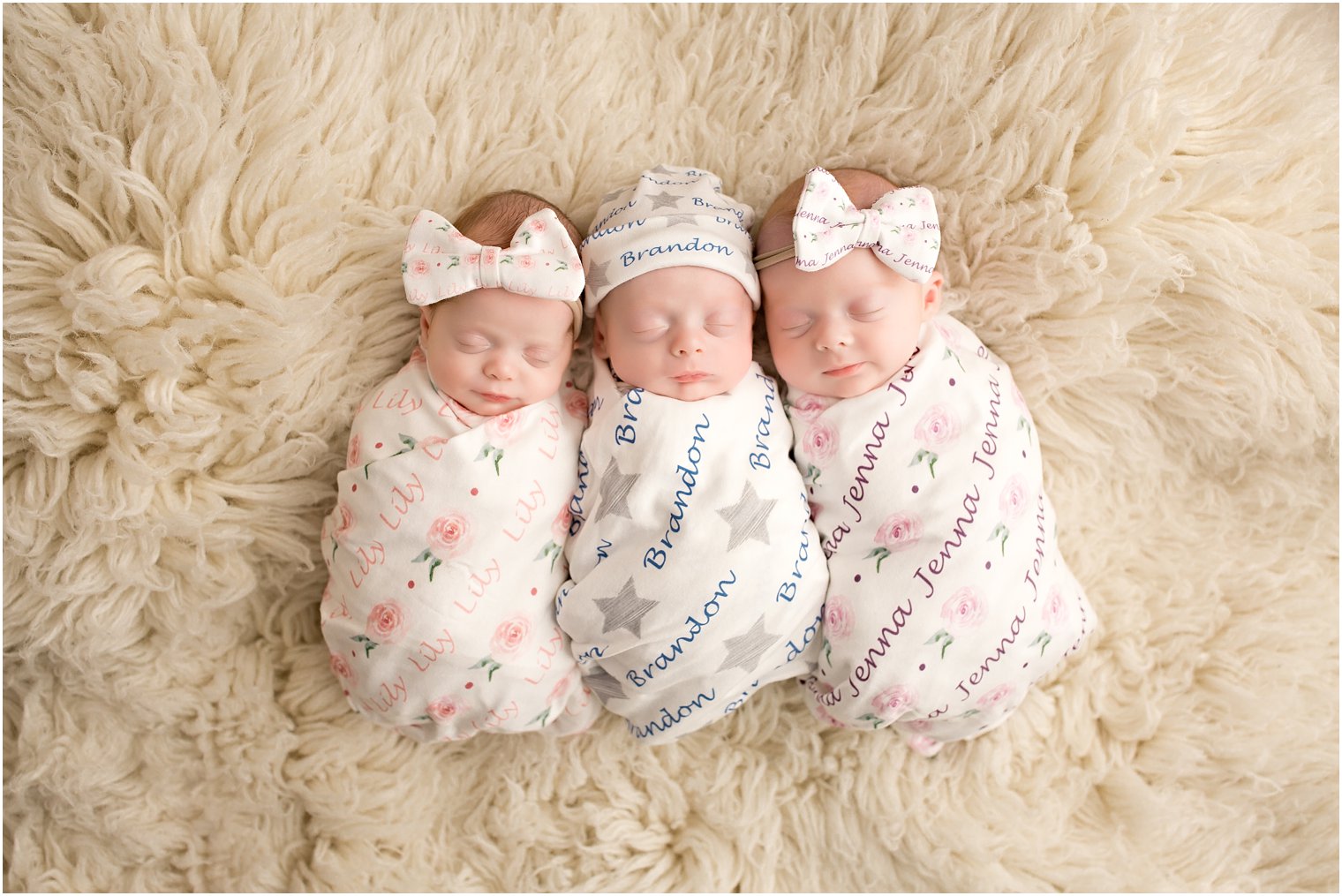 Newborns in personalized blankets