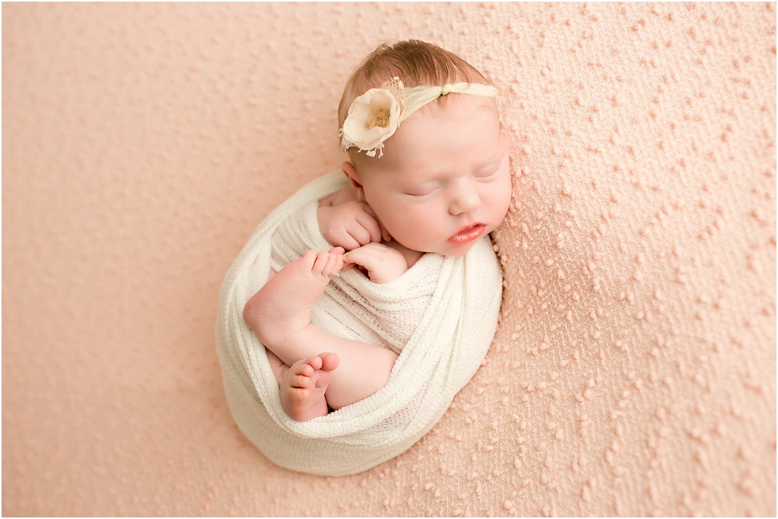 newborn baby girl during her newborn session 