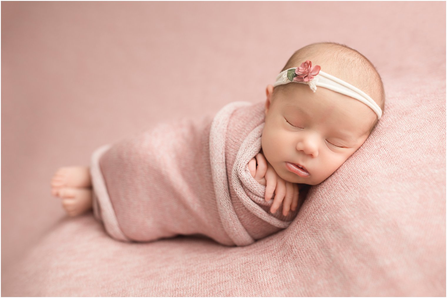 newborn girl on pink freebird shoppe blanket