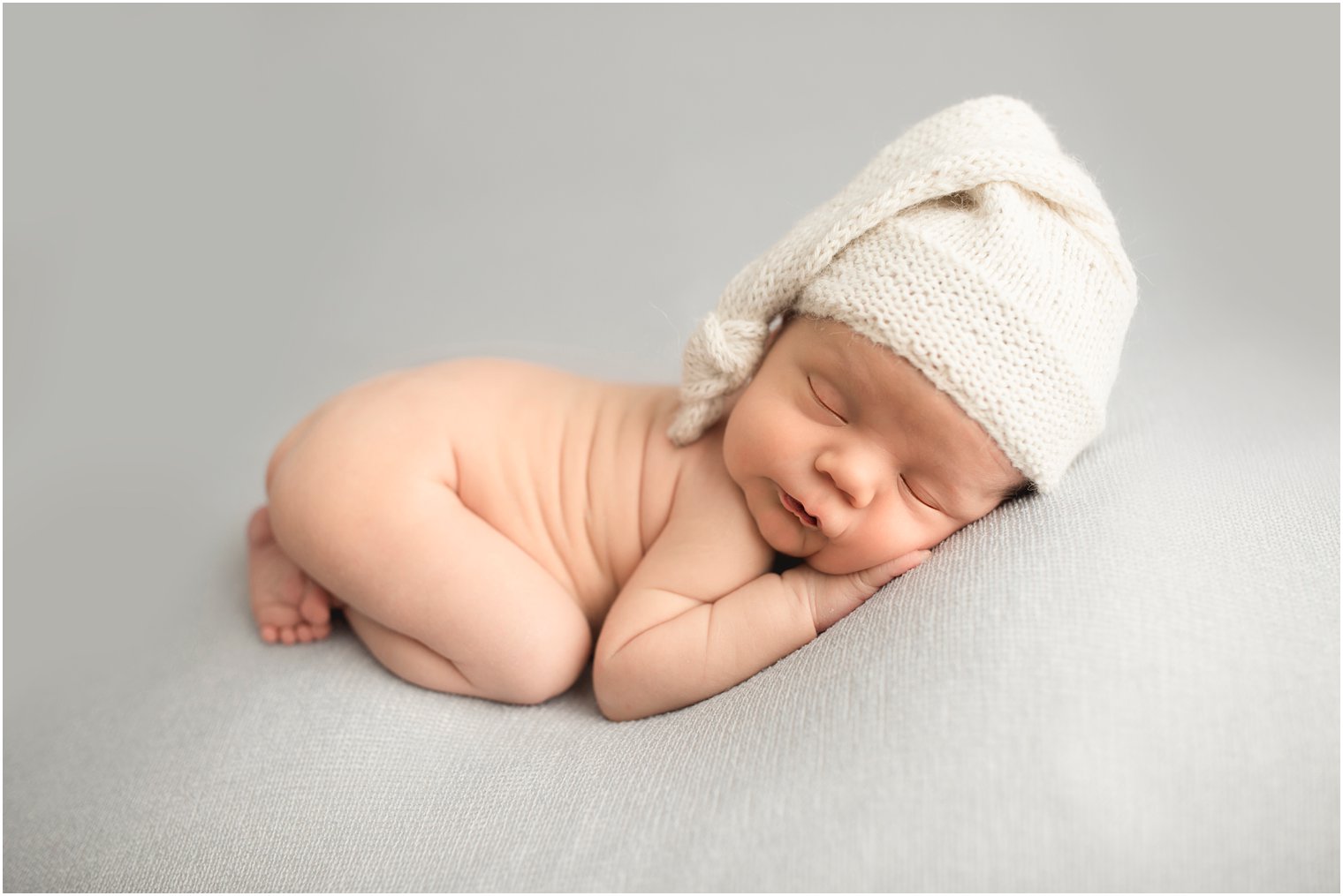 posed newborn photo in a studio