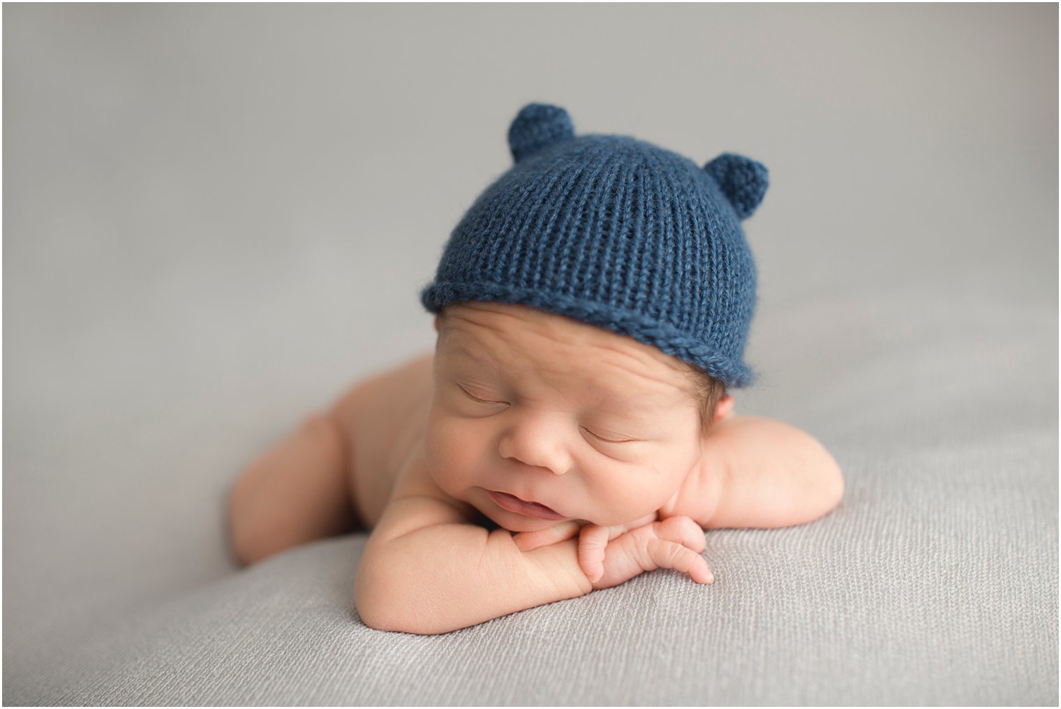 newborn boy in knit hat with ears