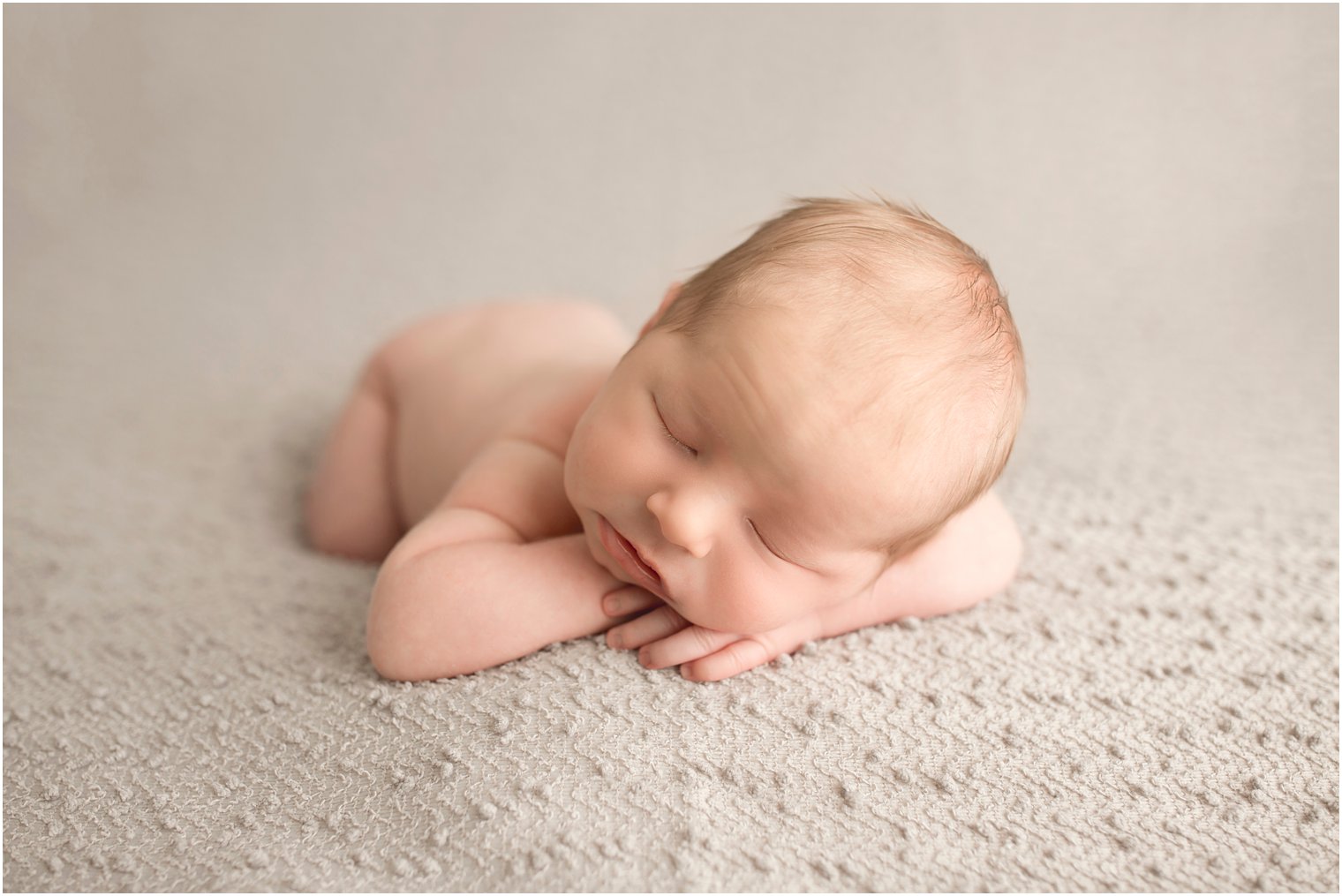 Newborn boy in chin on hands pose | Red Bank NJ Newborn Photography by Idalia Photography