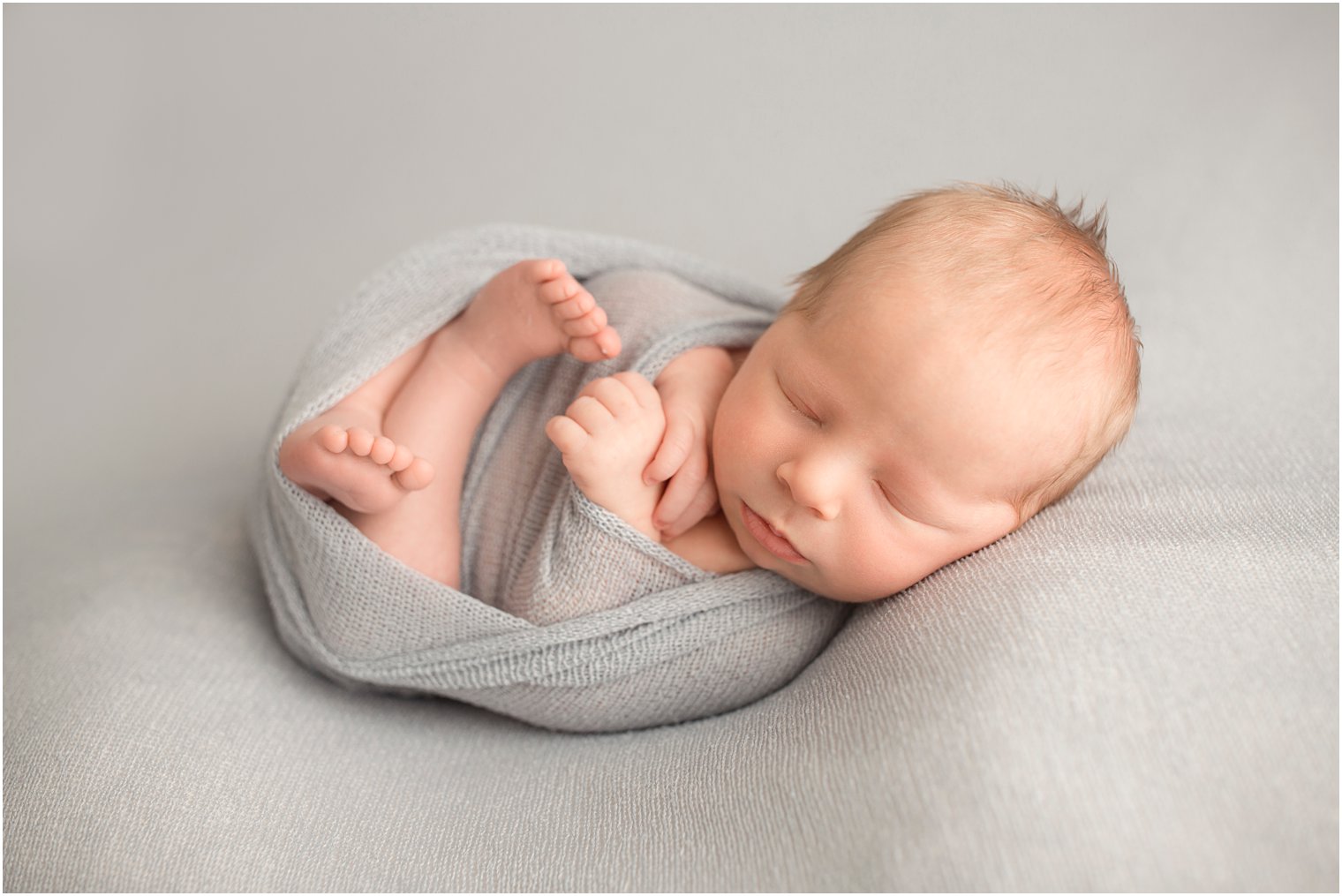 Newborn boy in blue blanket | Red Bank NJ Newborn Photography by Idalia Photography