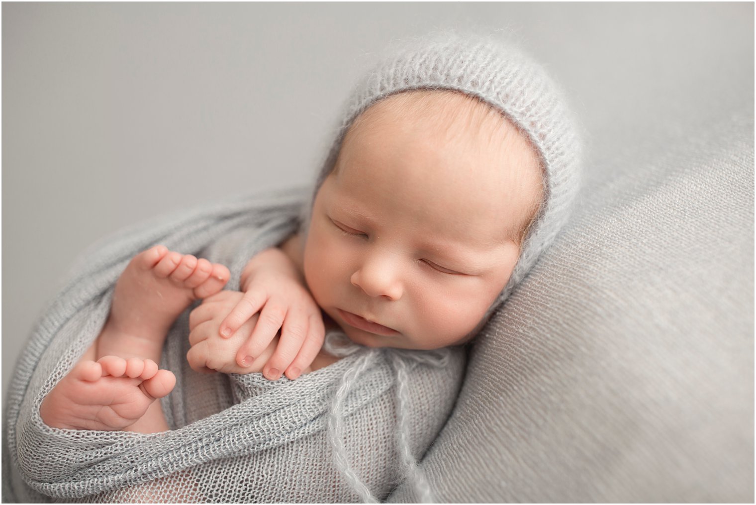 Sleepy newborn with knit hat | Red Bank NJ Newborn Photography by Idalia Photography