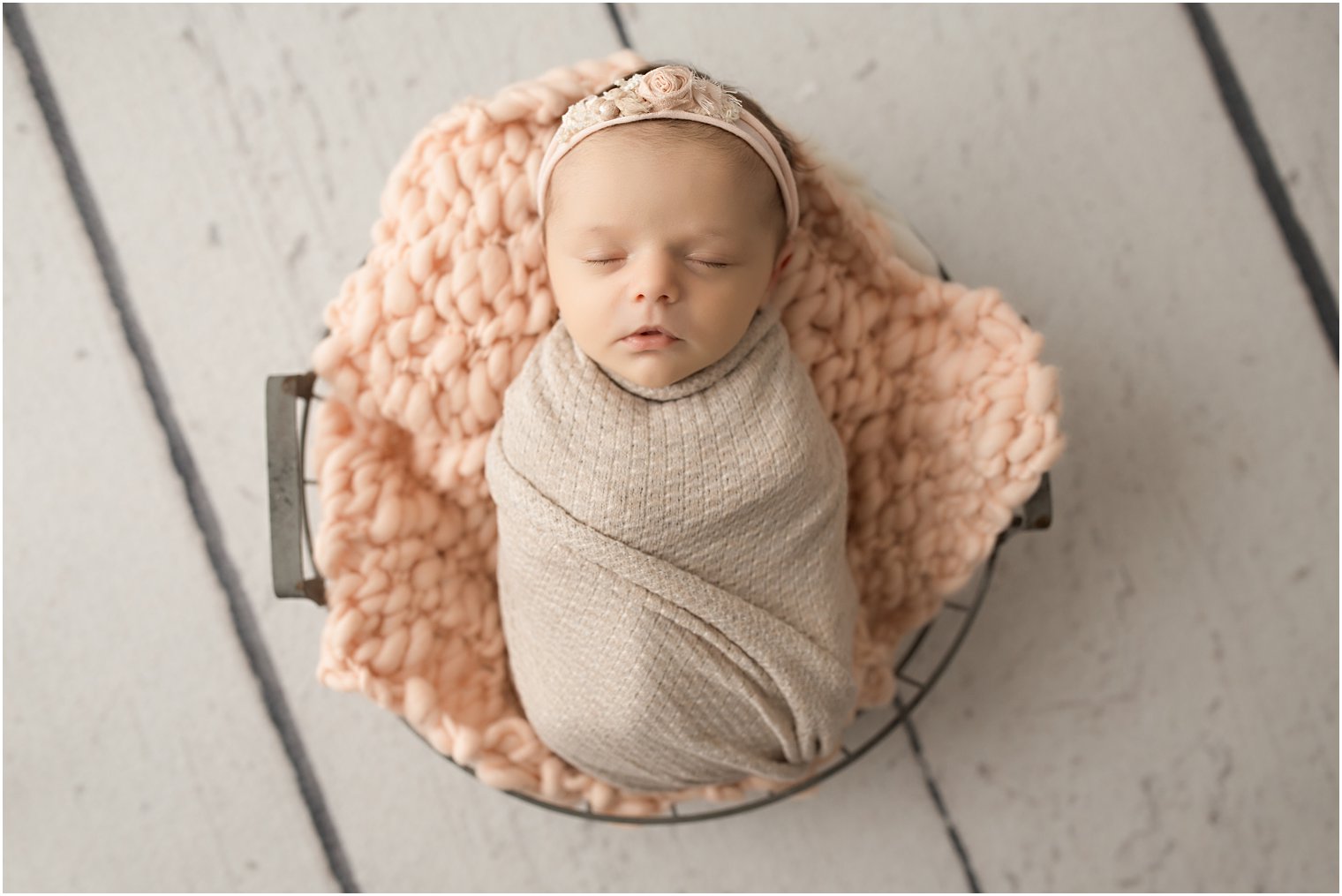 Newborn in a basket and blankets in peach tones | Burlington County Newborn Photographer | Newborn session by Idalia Photography