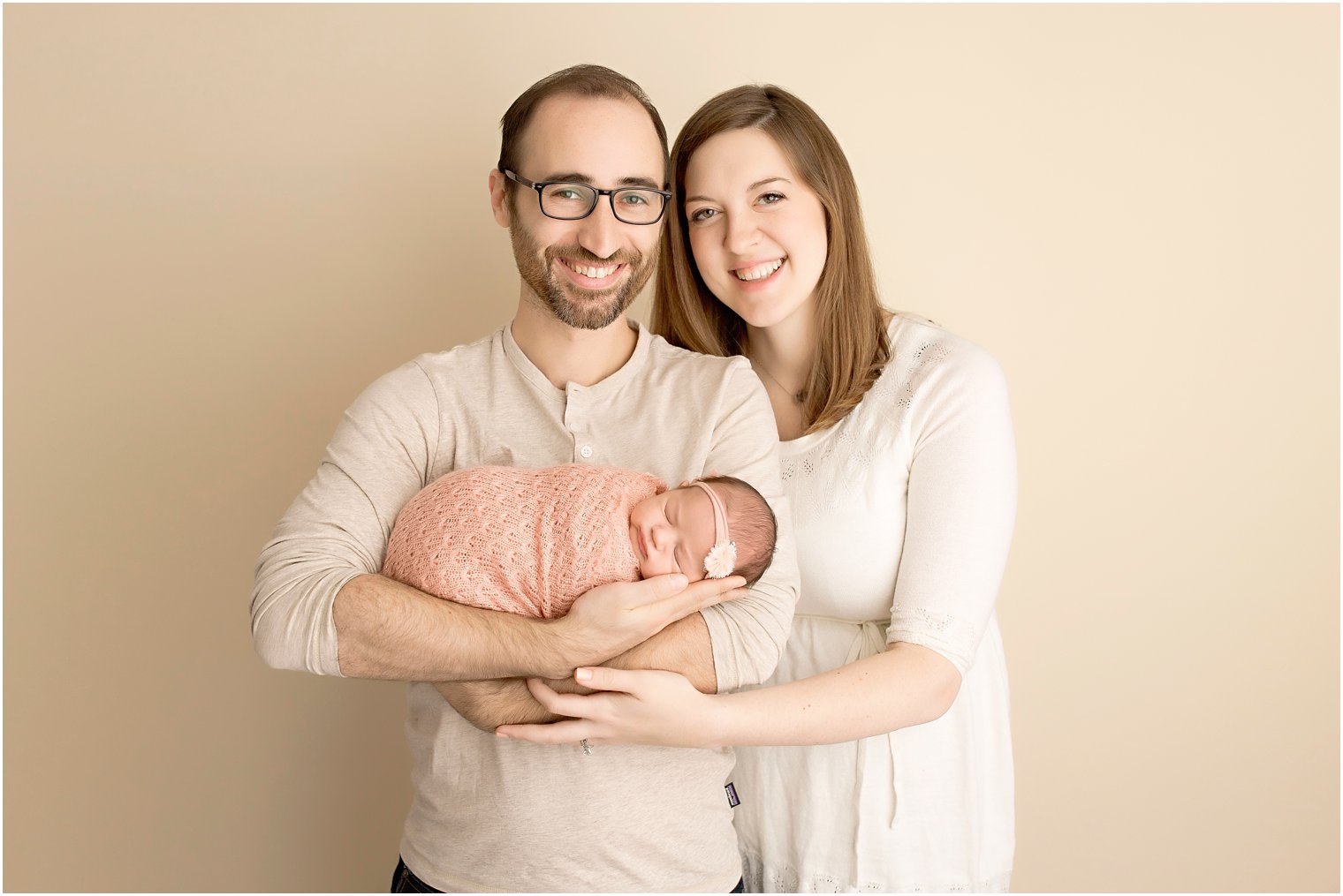 New parents with their little girl during newborn session