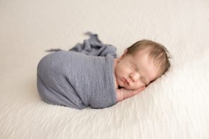 baby-boy-sleeping-grey-wrap