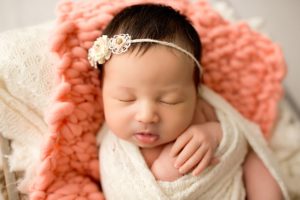 newborn baby girl with floral headband