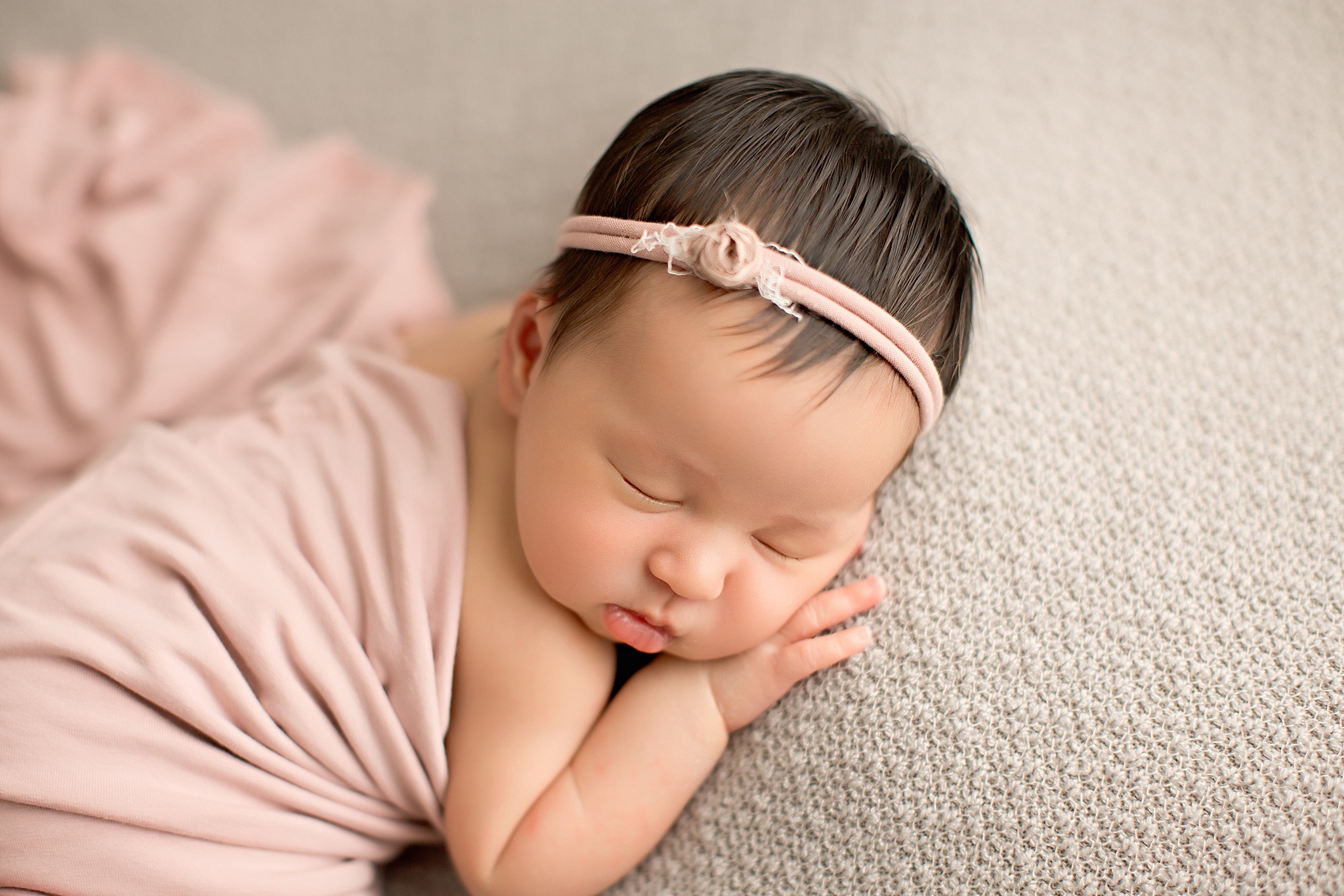 sleeping baby girl with pink headband