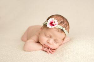 newborn-baby-girl-sleeps-during-newborn-portraits