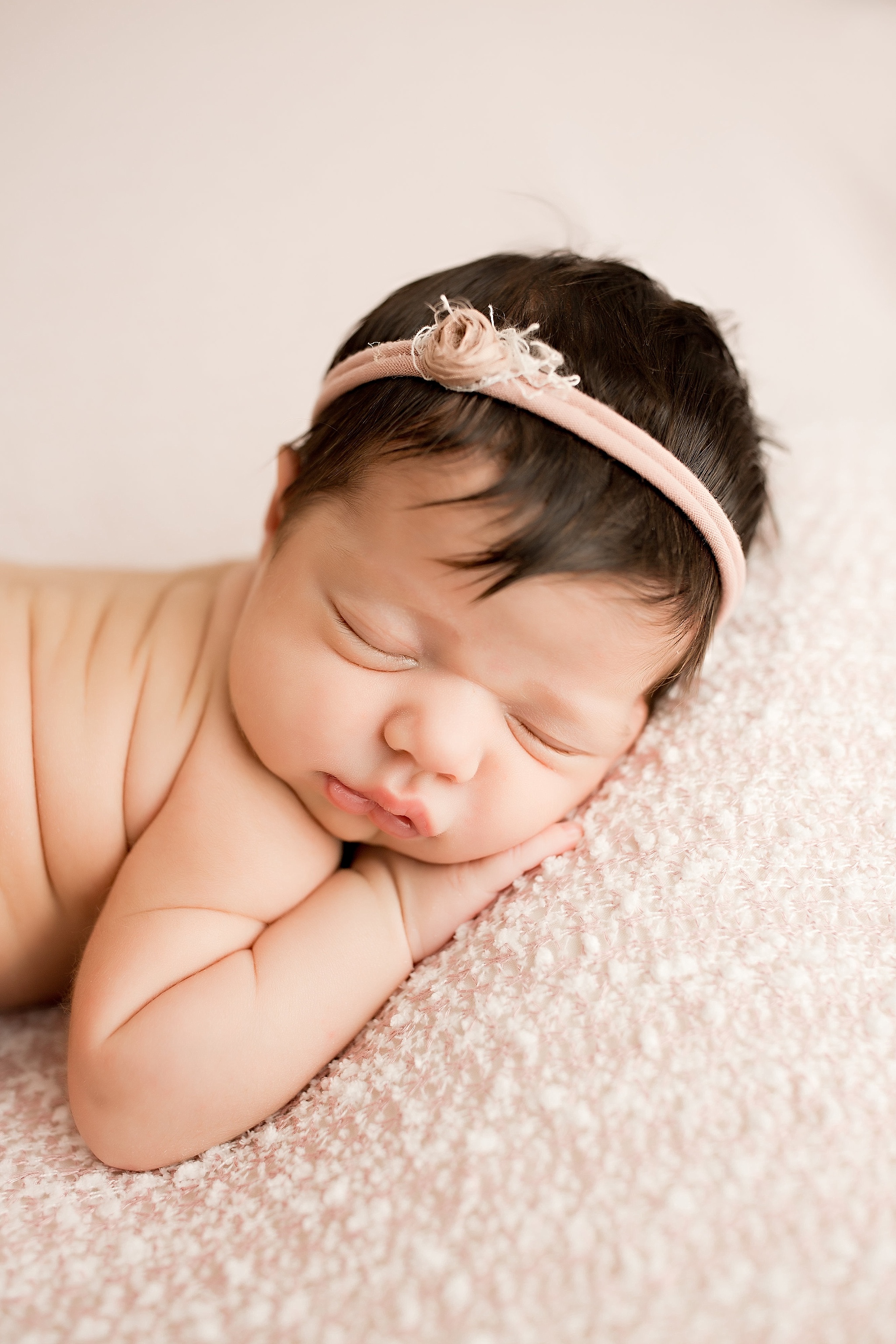 baby girl with rolls sleeping with floral headband
