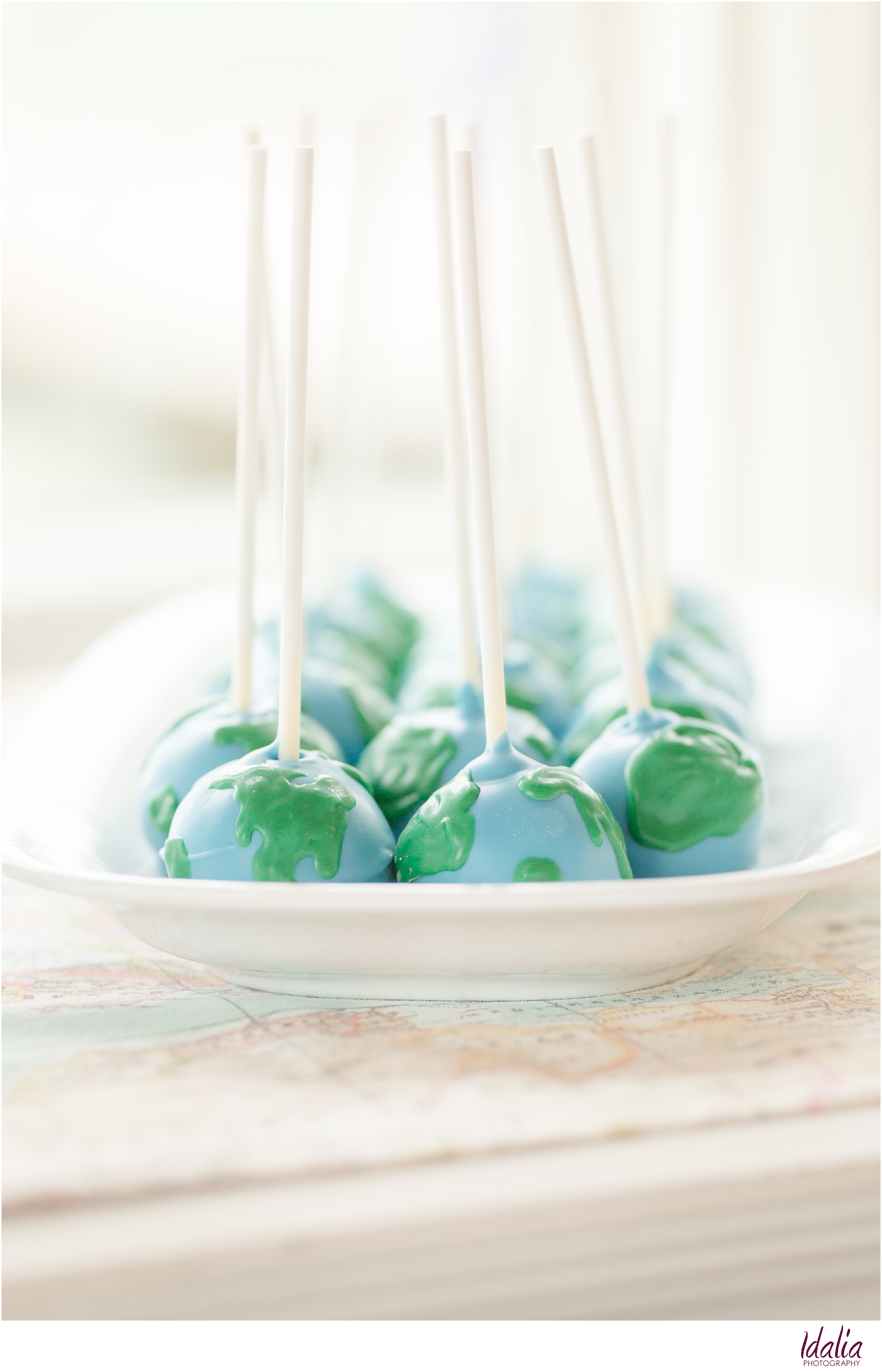 Travel-themed baby shower | Globe cake pops by Pastry Paige | Photo by Idalia Photography