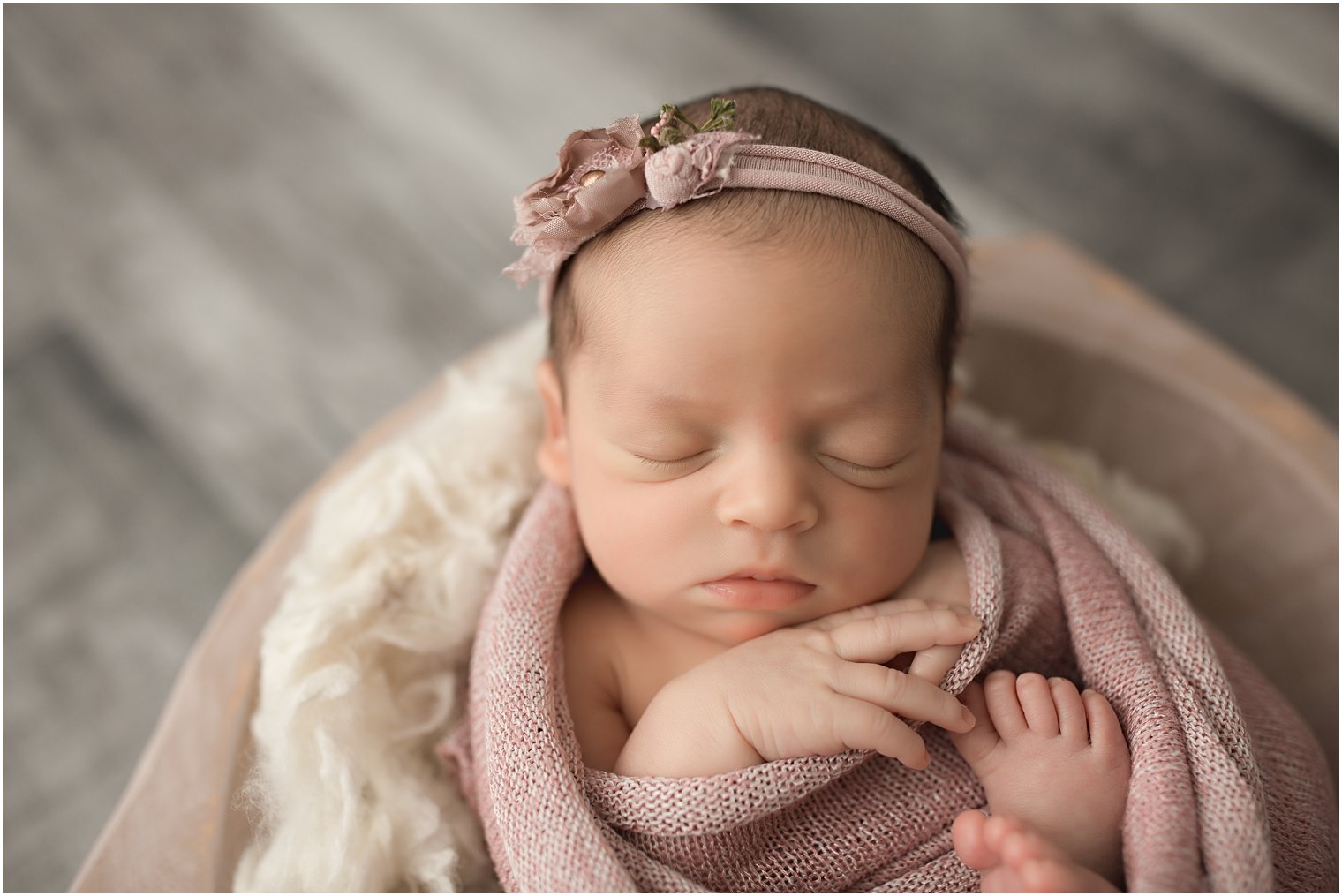 Wrapped newborn session with baby in a bowl | Photos by Newborn Photography
